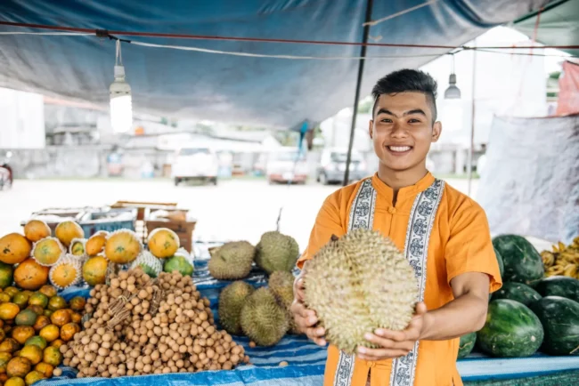 Thai man selling fruits